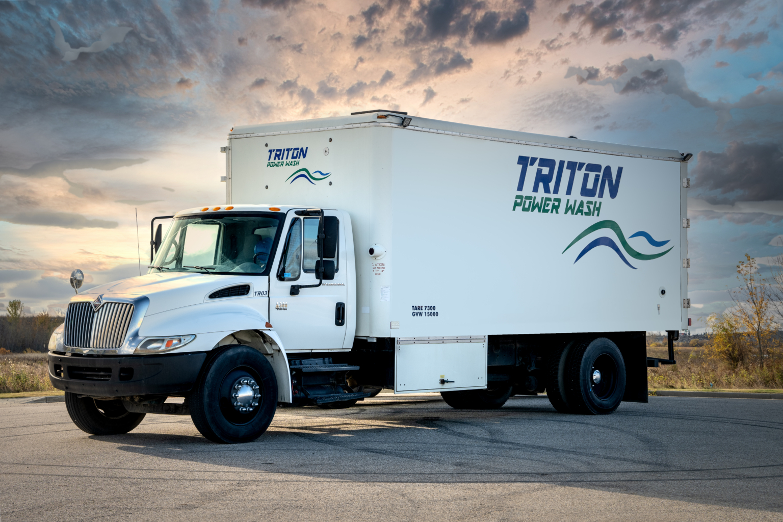 Triton Power Wash Truck with sky background